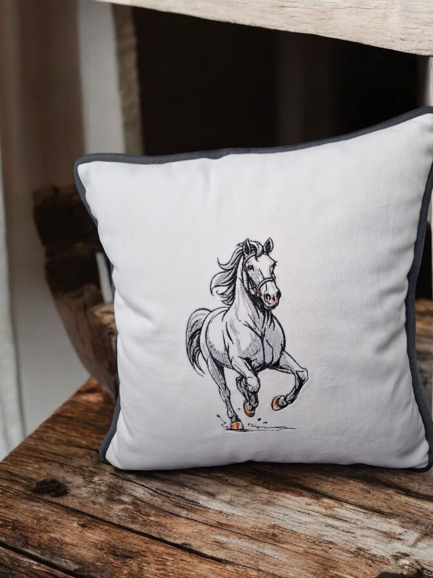 Embroidered cushion with a horse motif
