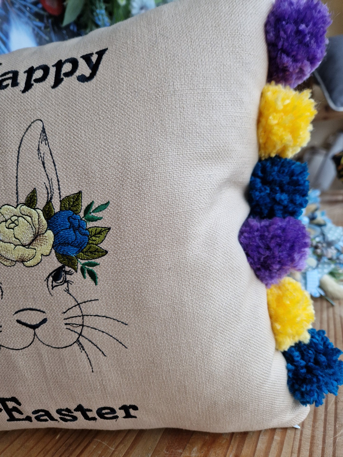 Easter embroidered cushion with pompoms