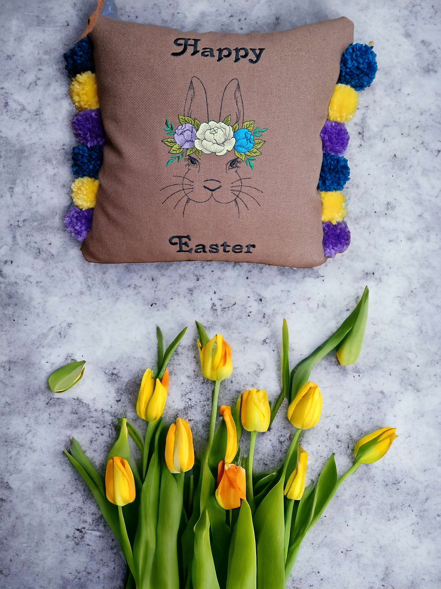 Easter embroidered cushion with pompoms