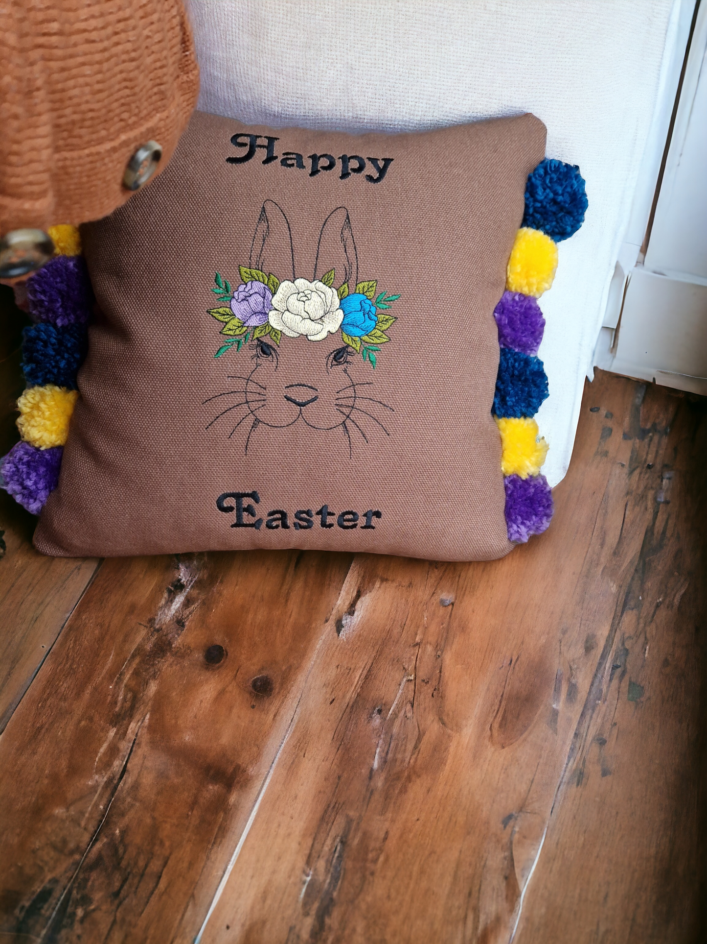 Easter embroidered cushion with pompoms