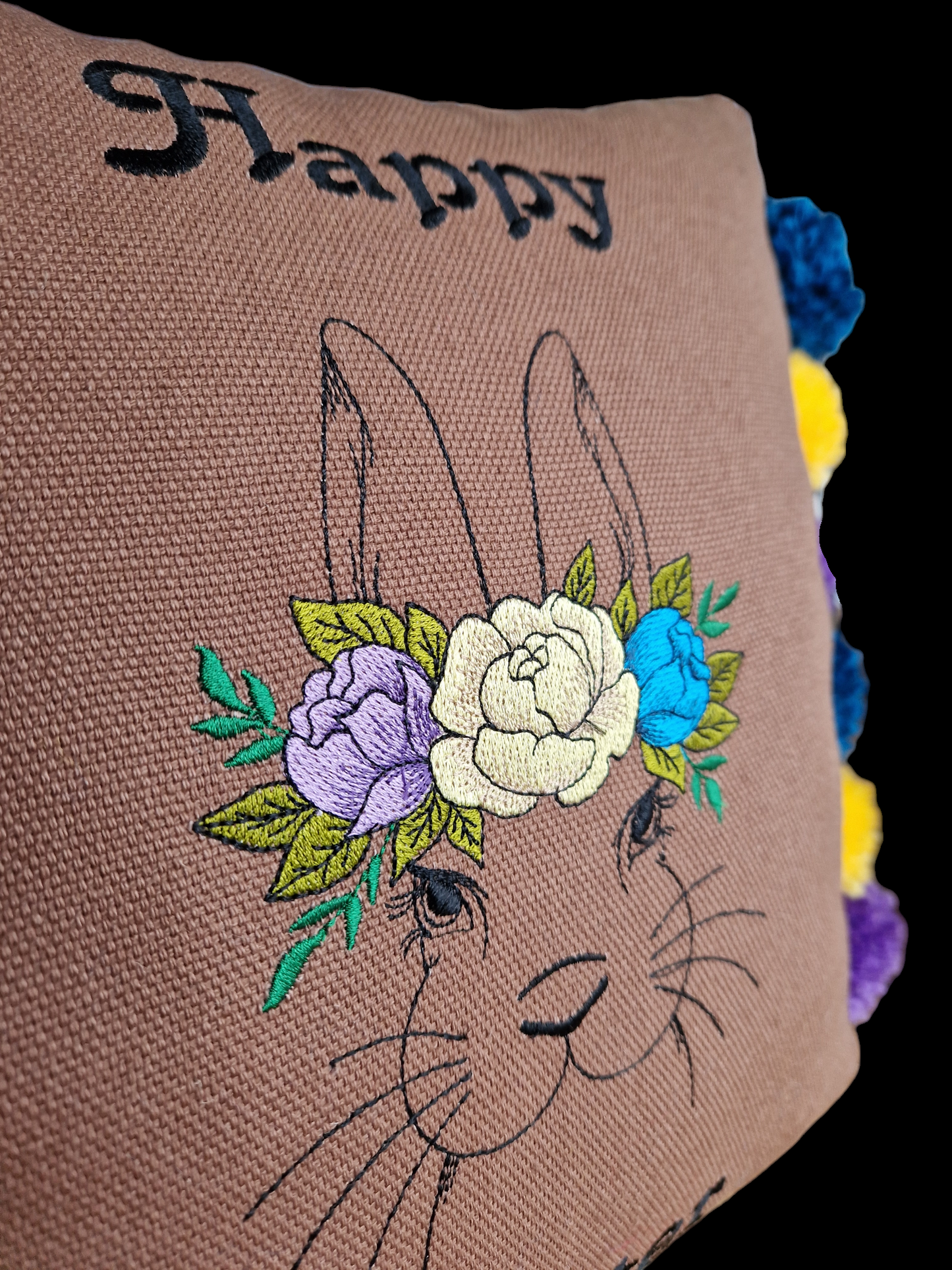 Easter embroidered cushion with pompoms