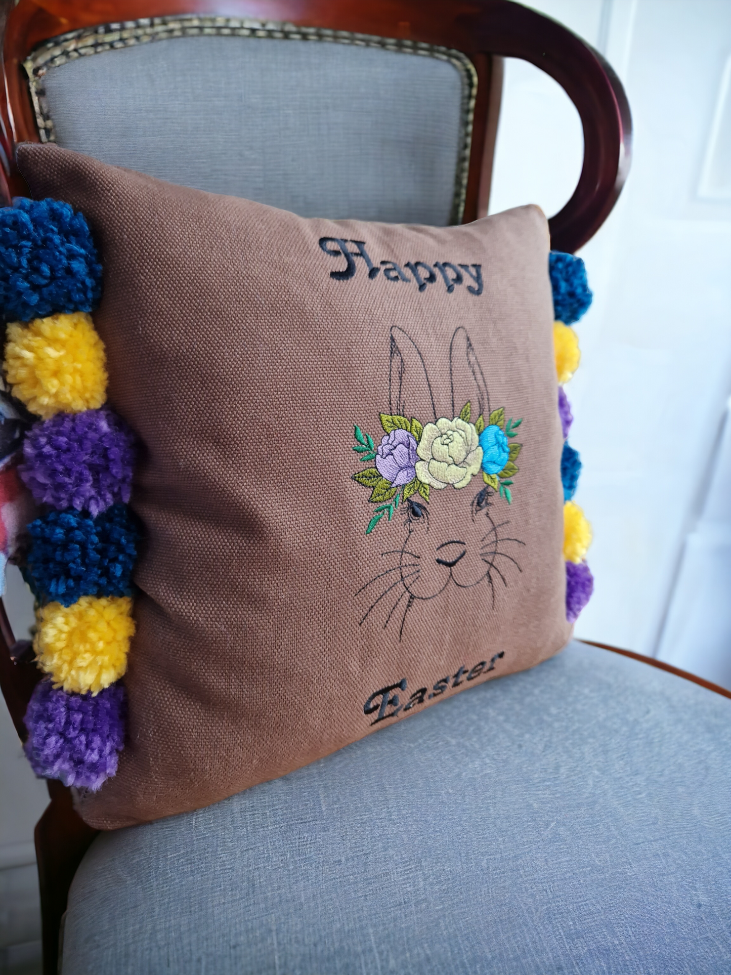 Easter embroidered cushion with pompoms