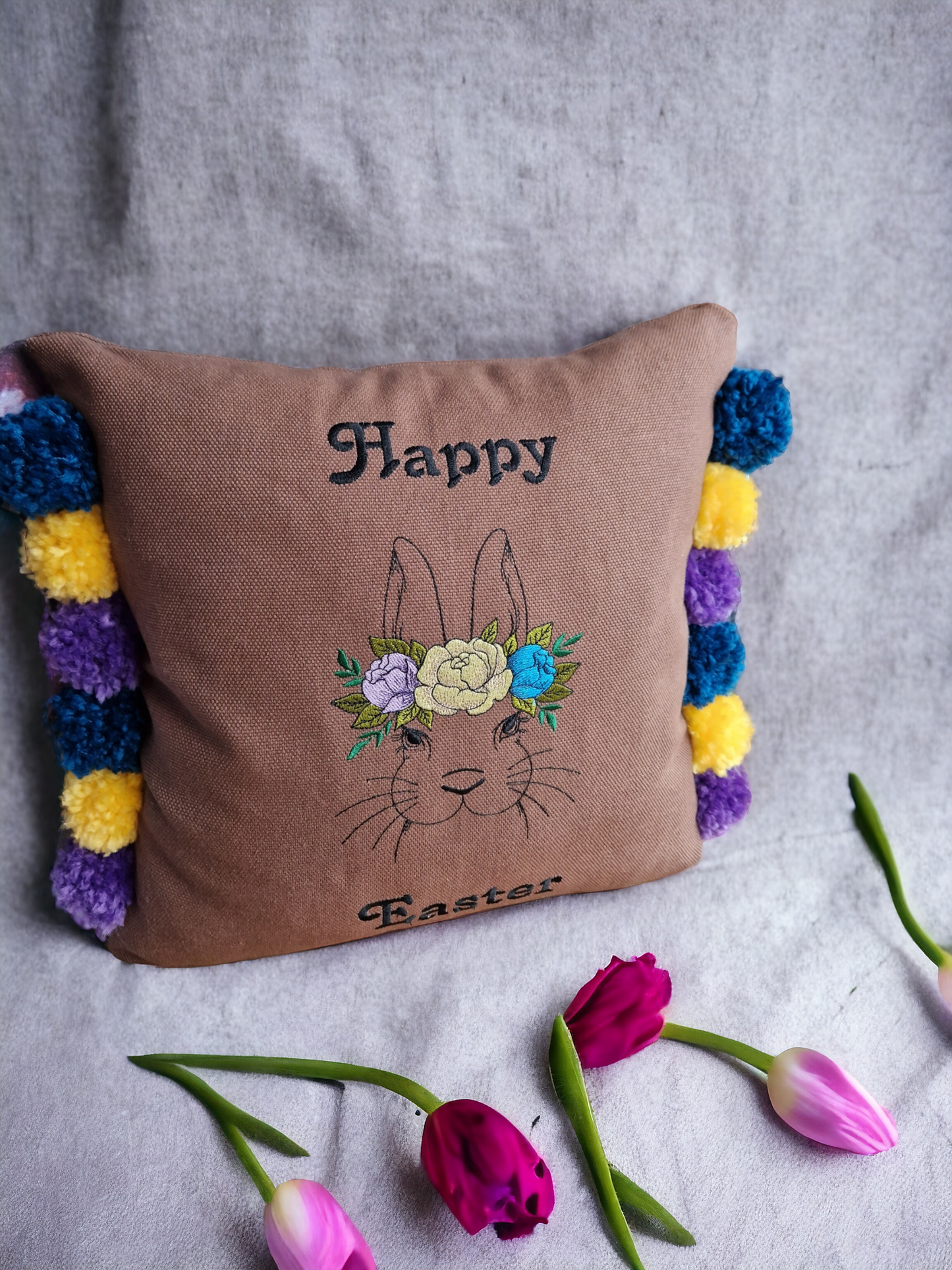 Easter embroidered cushion with pompoms