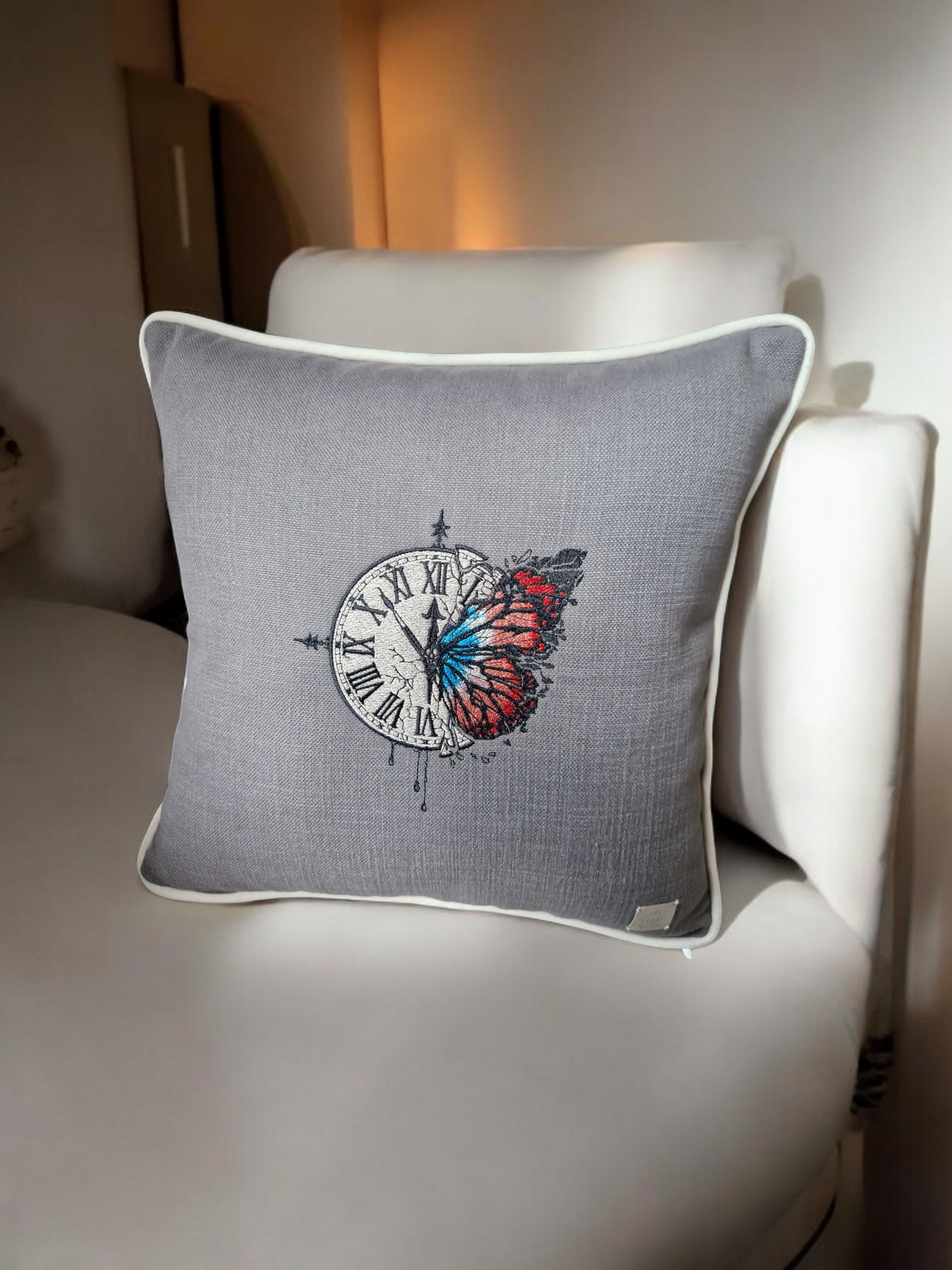 Embroidered cushion "clock with a butterfly"