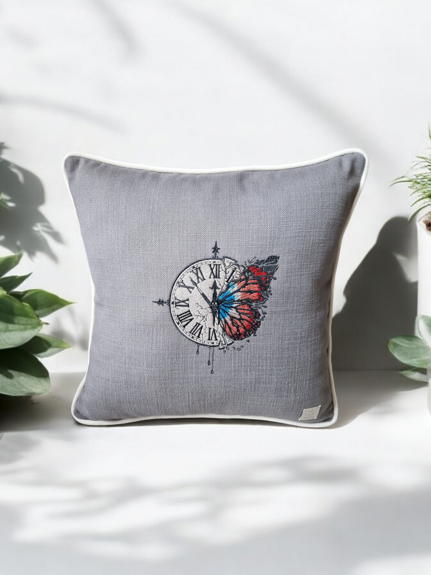 Embroidered cushion "clock with a butterfly"