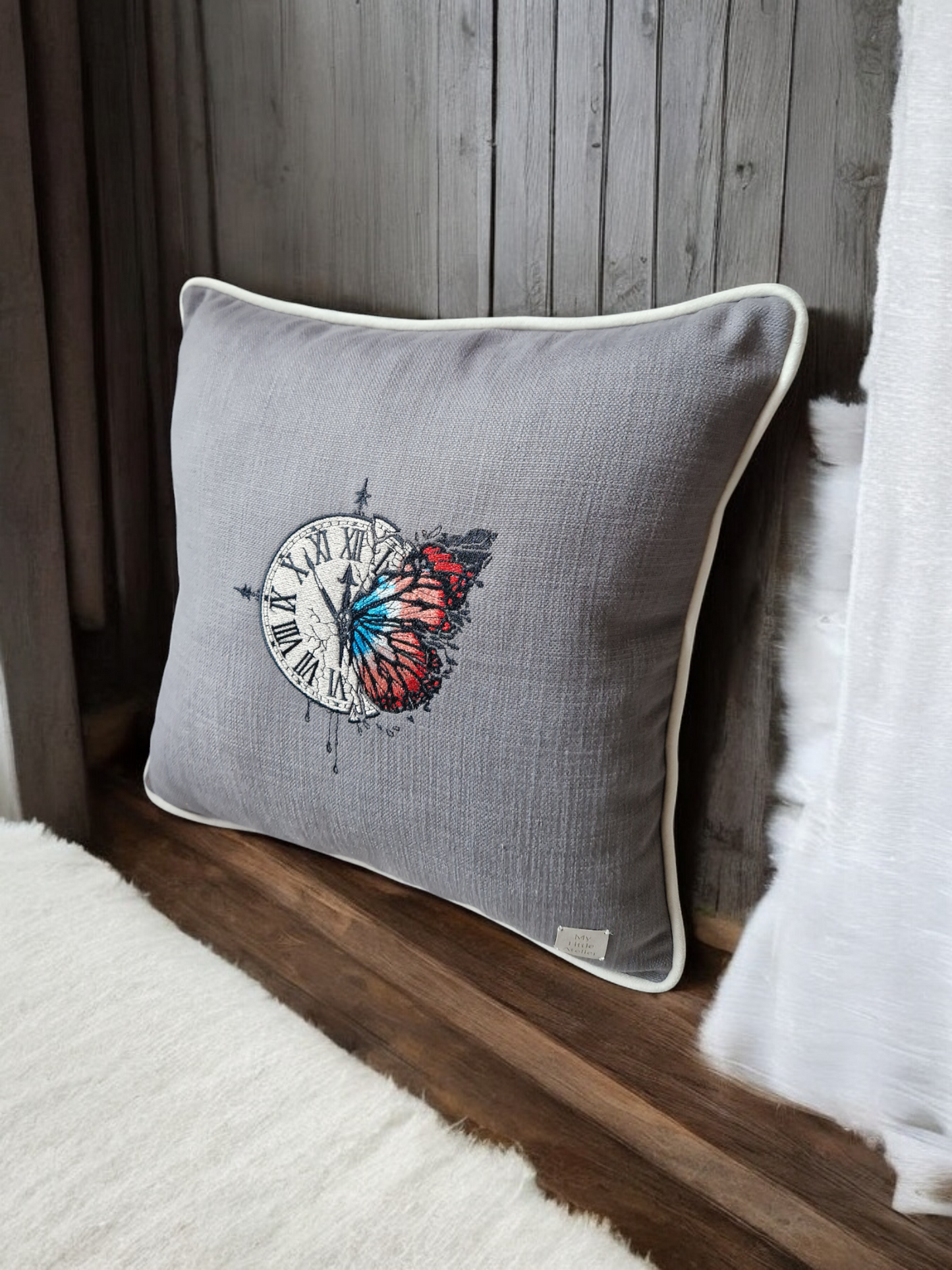 Embroidered cushion "clock with a butterfly"