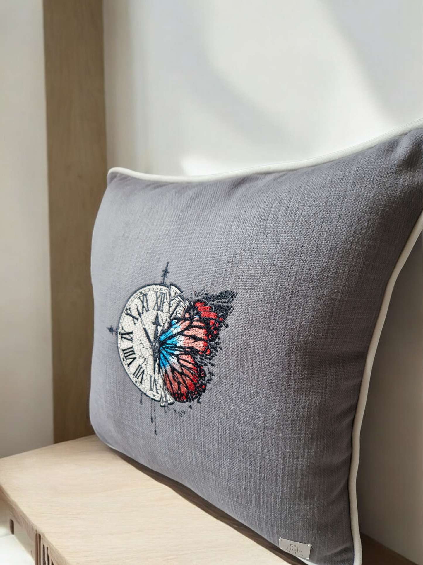 Embroidered cushion "clock with a butterfly"