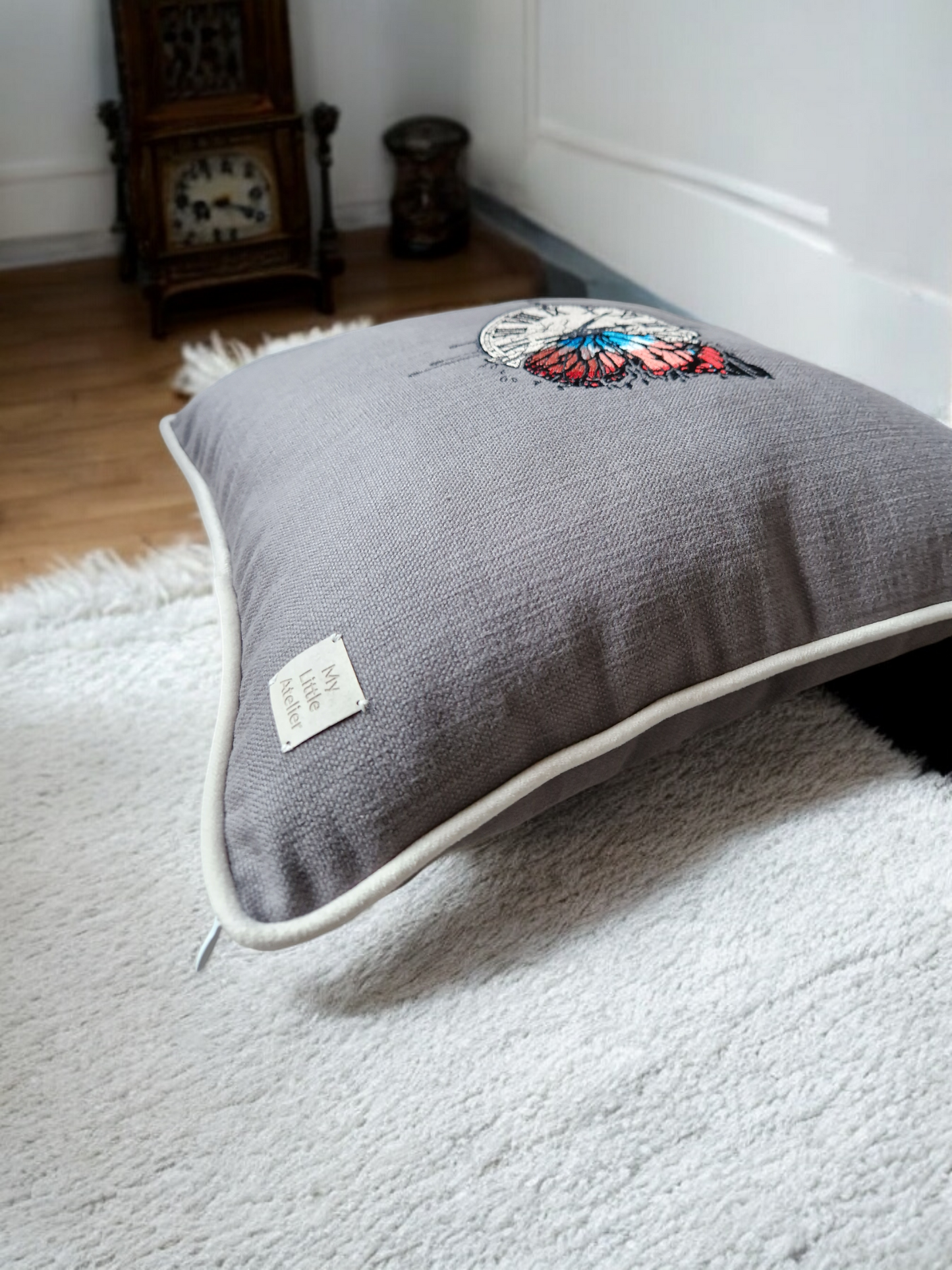 Embroidered cushion "clock with a butterfly"