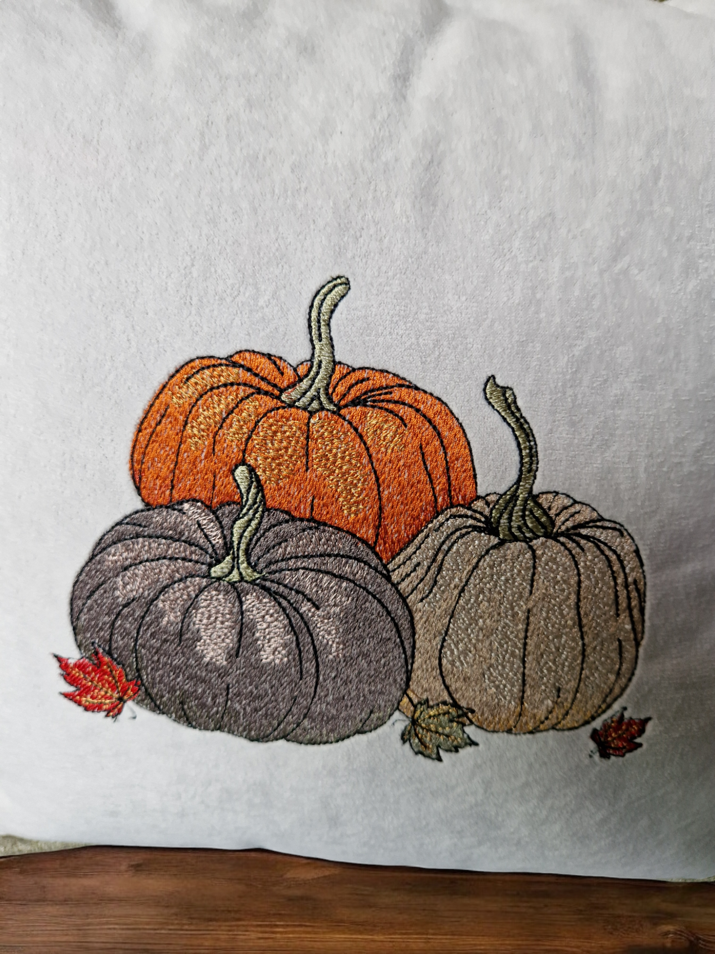 Embroidered "triple pumpkin" light grey cushion