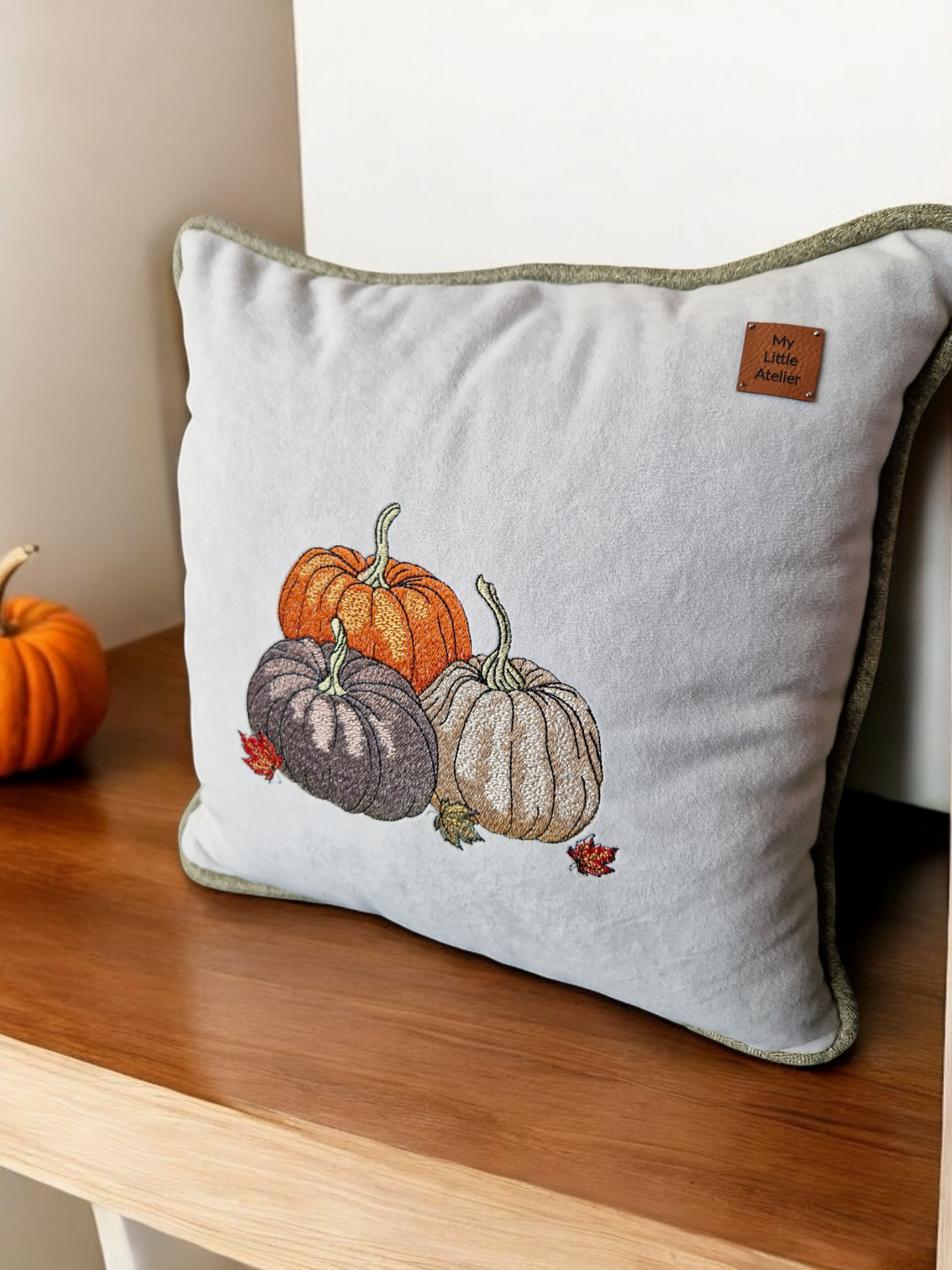 Embroidered "triple pumpkin" light grey cushion