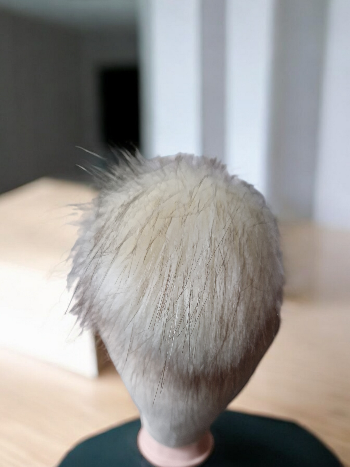 Cream beige women's fleece hat with cream fur pompom.